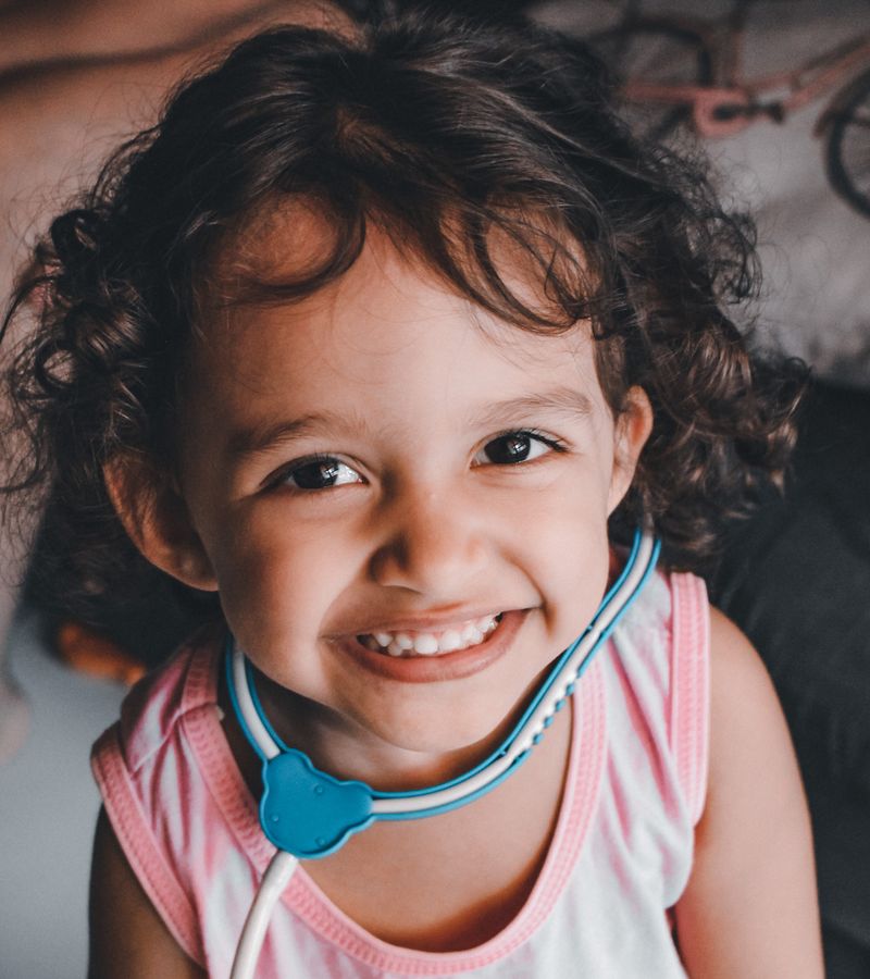 Pediatrician visiting child at home