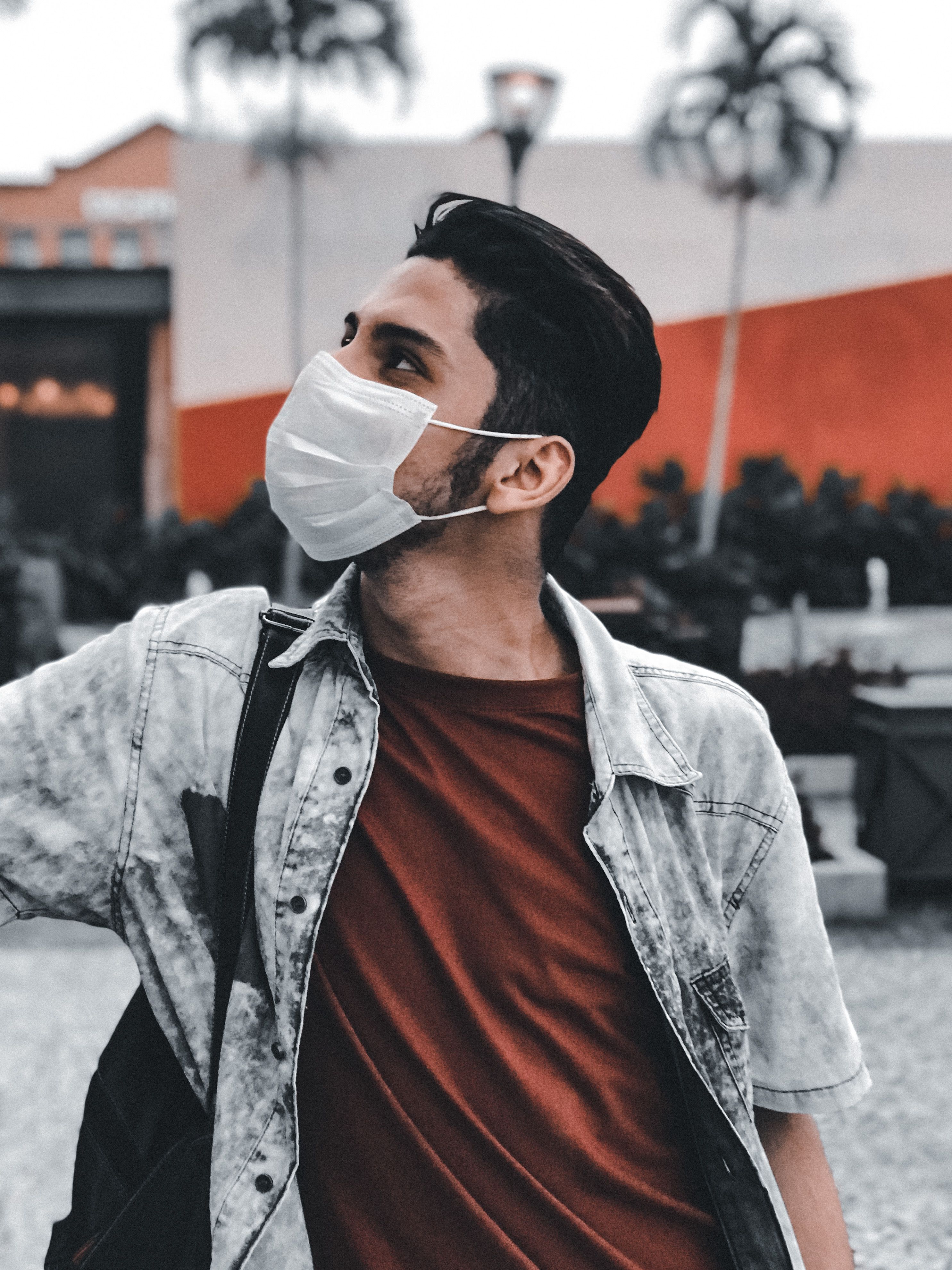 A Man Wearing a Face Mask Looking Up · Free Stock Photo