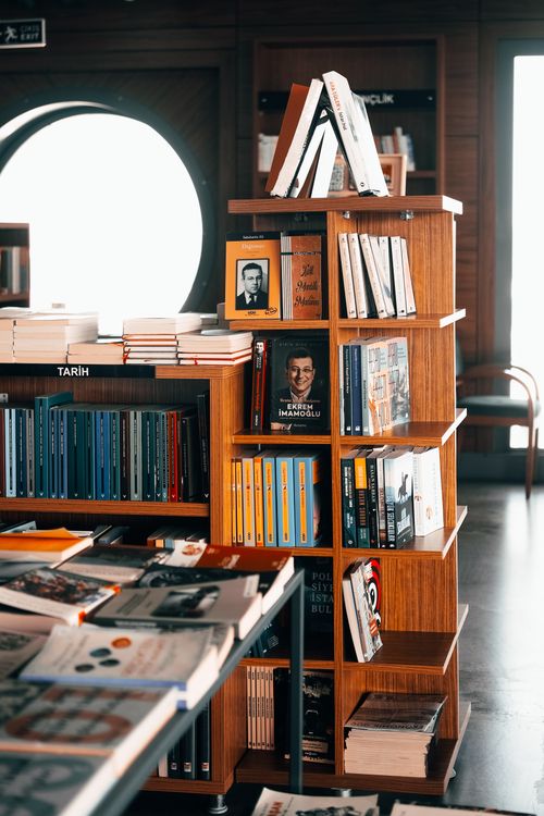 Free Bookshelves in a warm İstanbul bookstore showcasing a variety of literature and knowledge. Stock Photo