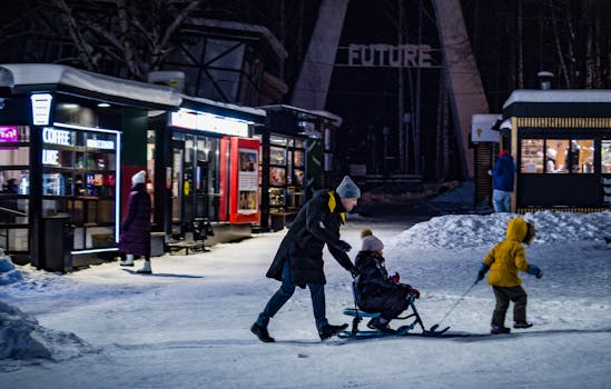 A family enjoys a sleigh ride on a snowy winter street at night, capturing quality time.