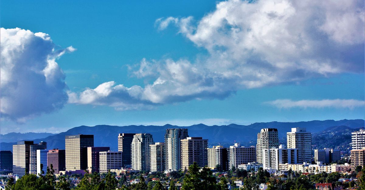 Captivating cityscape featuring high-rise skyscrapers against a vibrant blue sky.