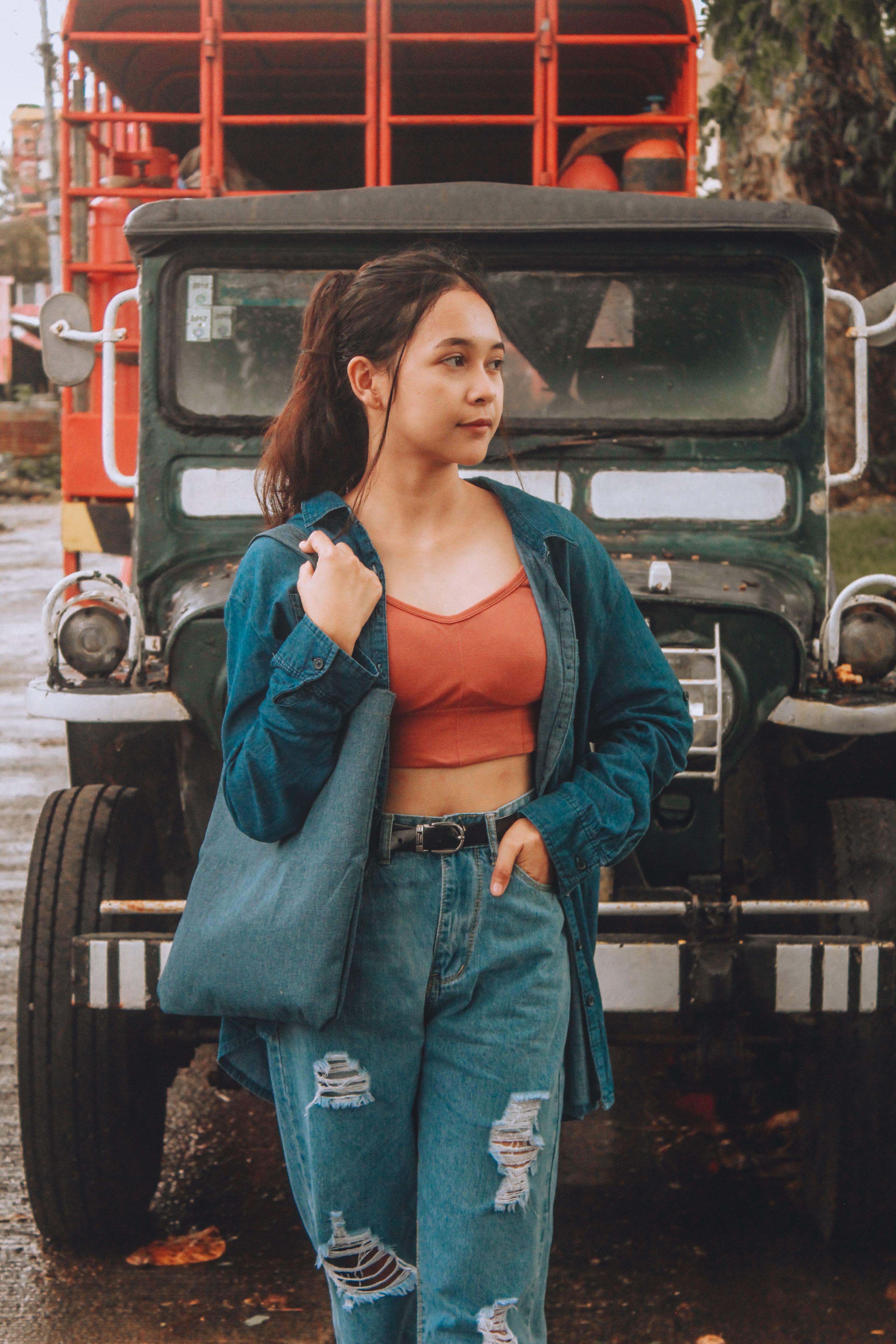 A Woman in Blue Denim Jacket and Denim Pants · Free Stock Photo