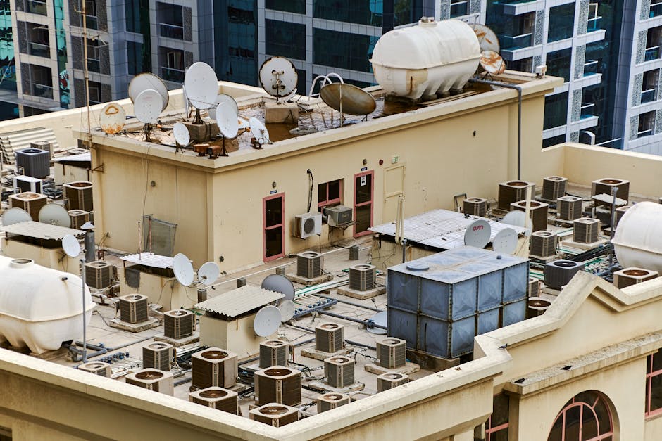 complex commercial roof with multiple HVAC units and skylights - commercial roof replacement cost complex commercial roof with multiple HVAC units and skylights - commercial roof replacement cost