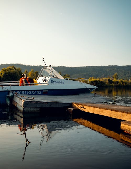 A Boat Docked on the Lake