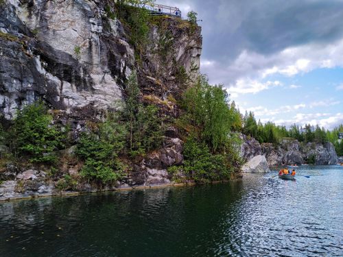Free Explore breathtaking cliffs and serene waters while kayaking in Republic of Karelia, Russia. Stock Photo