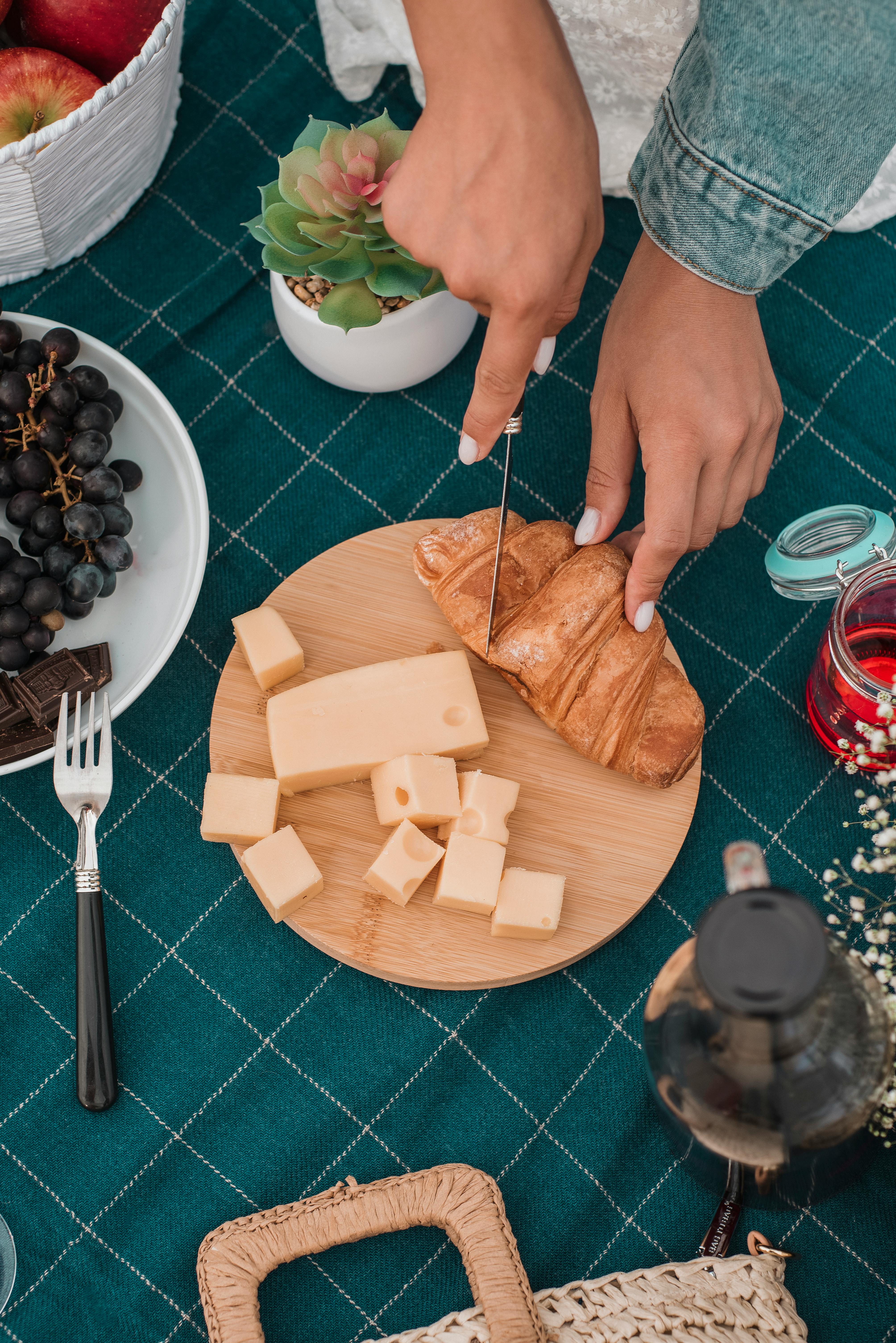 picnic set up with bread rolls and grapes