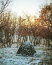 Black and White Tent on Snow Covered Ground during Sunset