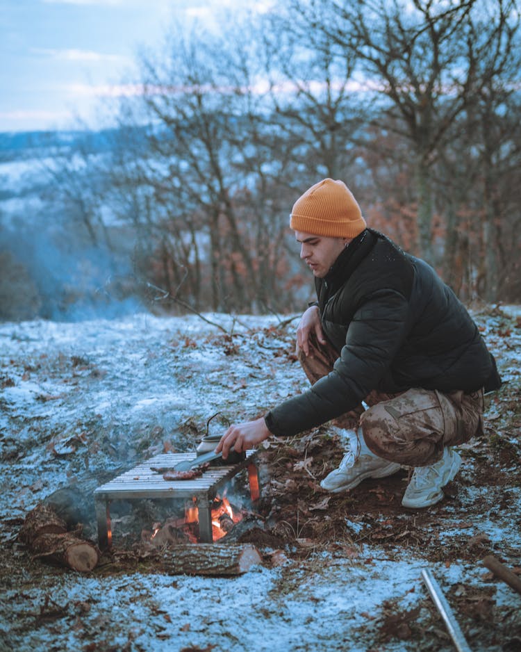 A Man Grilling Meat