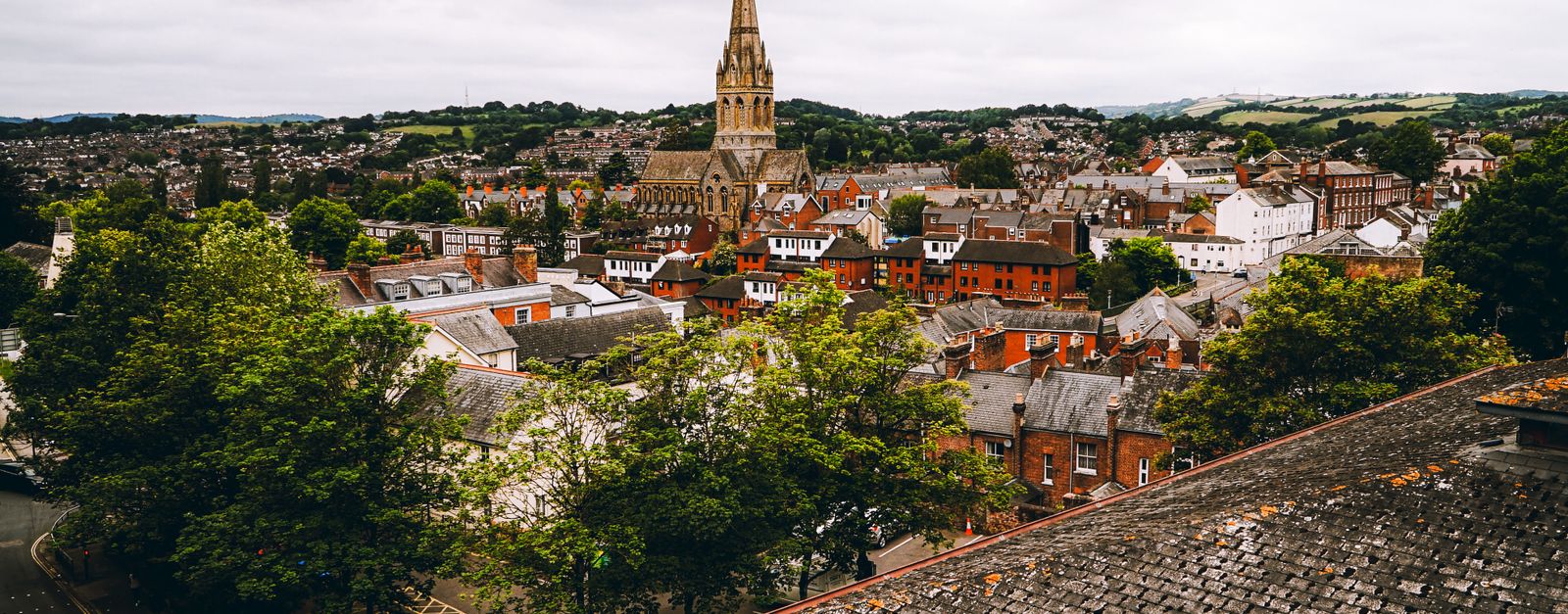 Aerial view of Exeter, England showcasing historic architecture and scenic urban landscape.