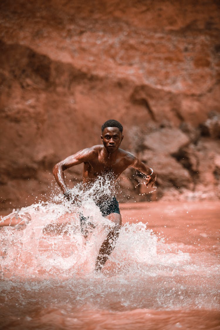 Man Running Through Water