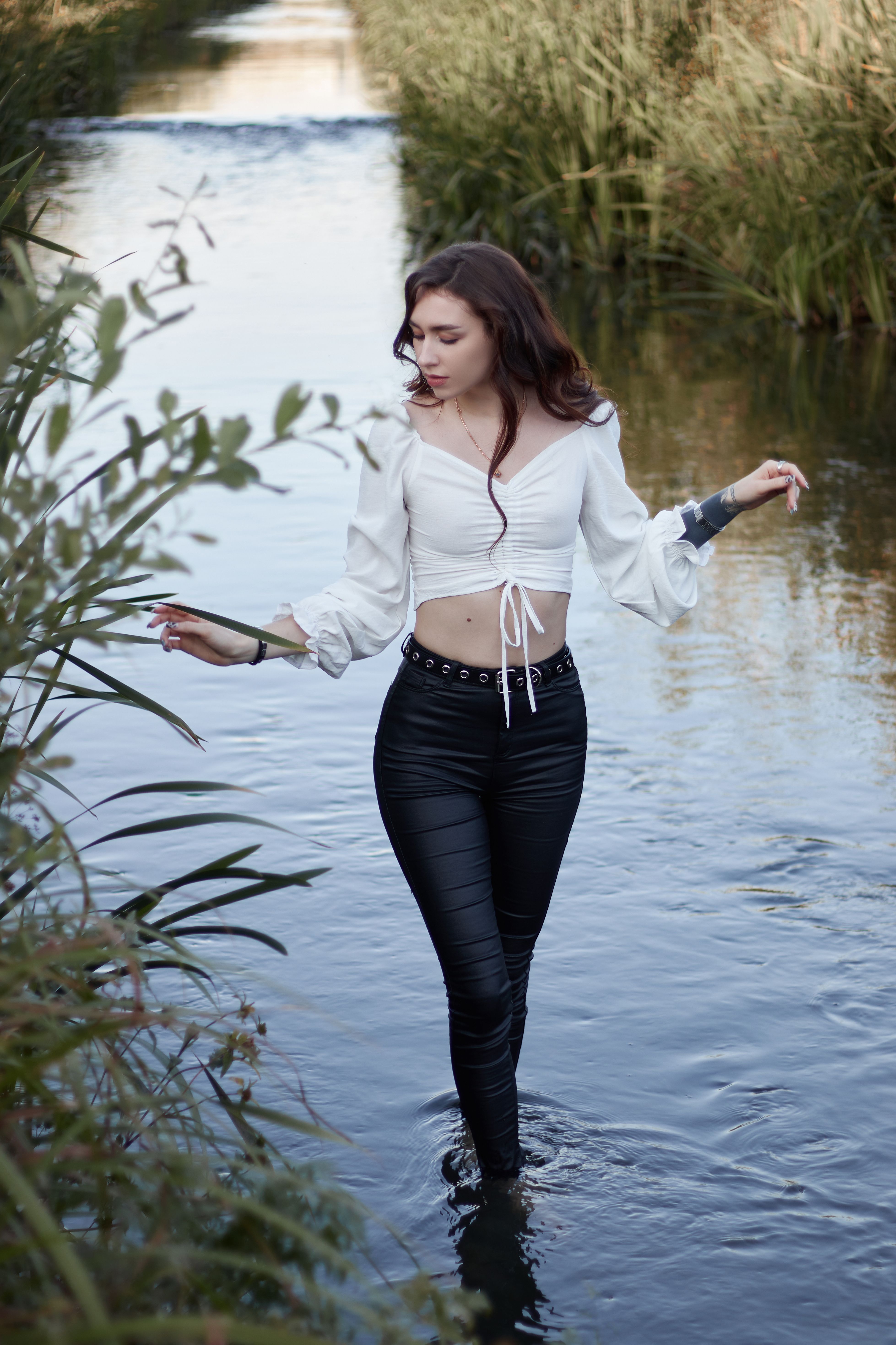 A Woman in White Long Sleeve Shirt and Black Pants · Free Stock Photo