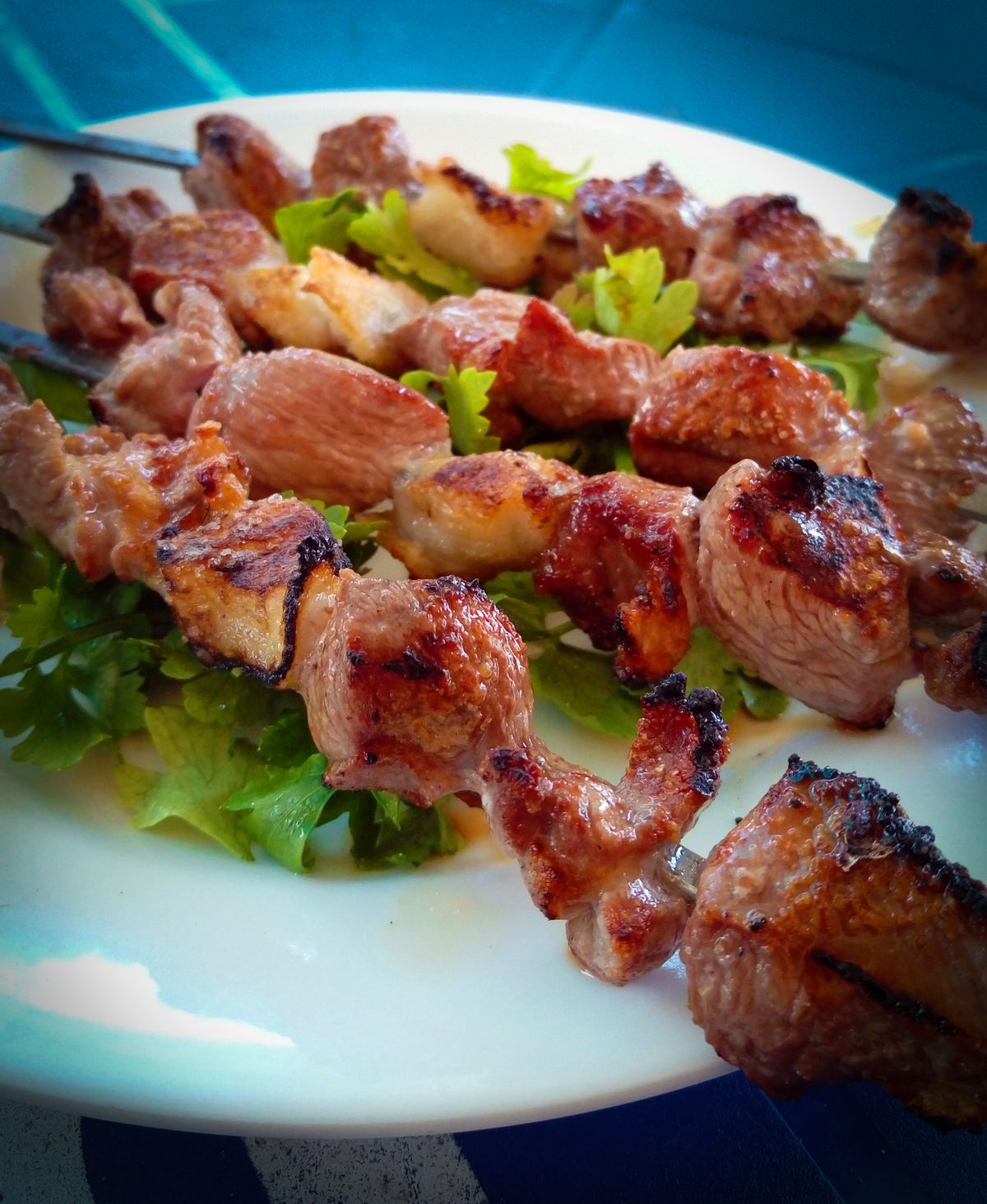 Balkan grilled cevapi served with somun bread and onions