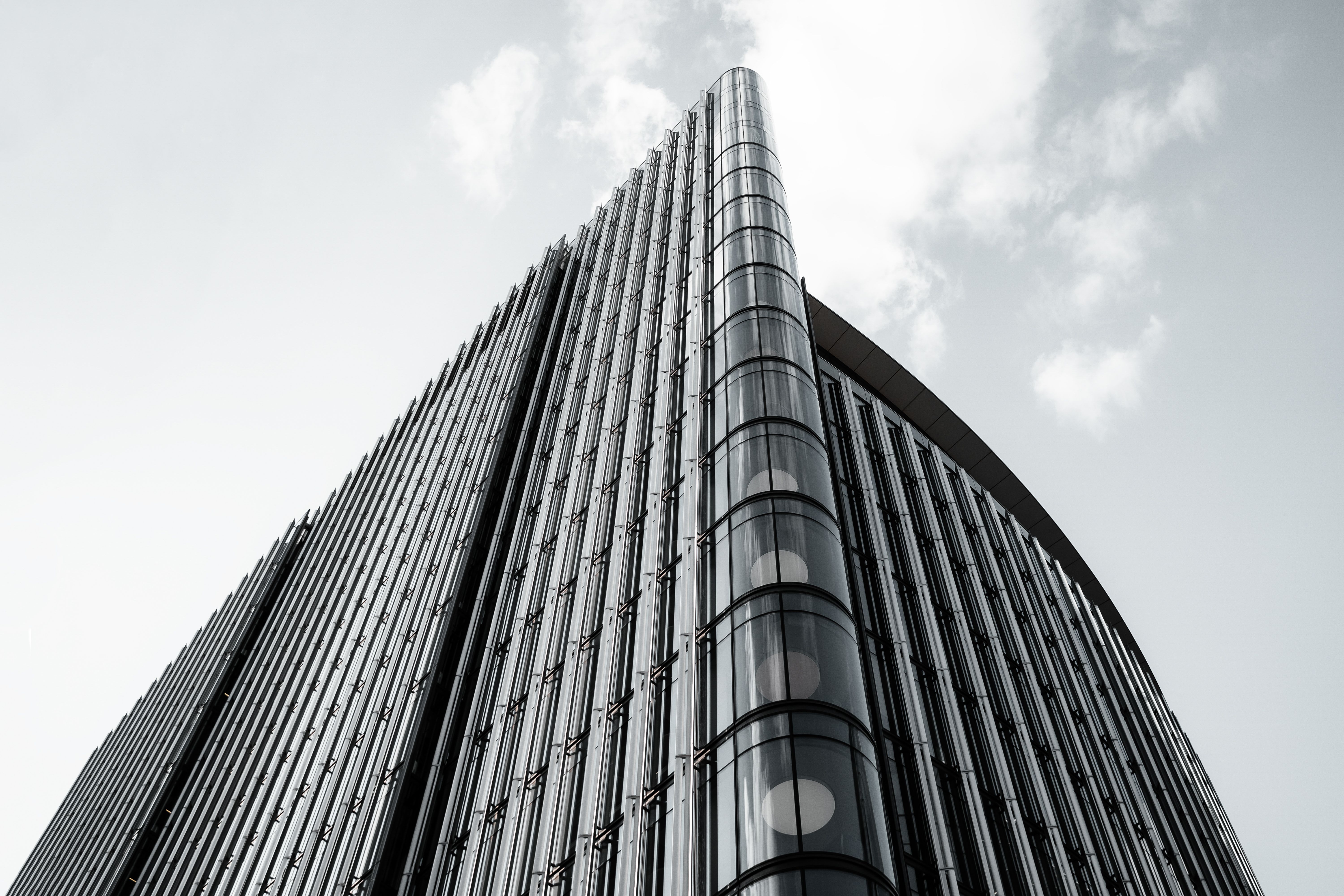 A sleek and modern high-rise building exterior photographed in London, England.
