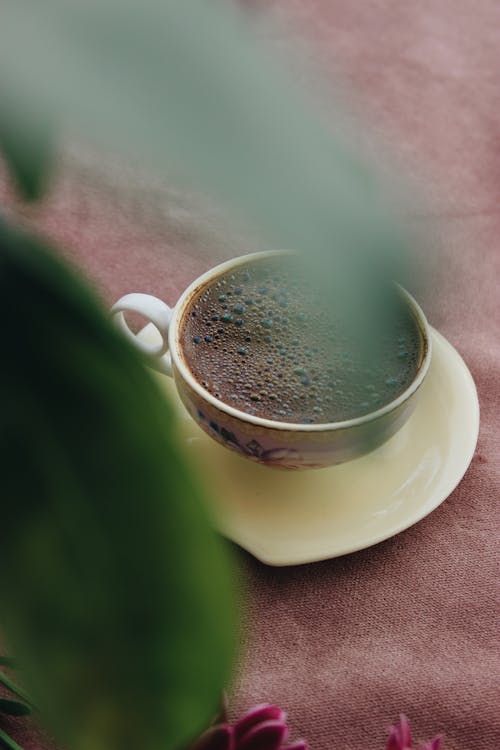 Brown Drink on White Ceramic Cup