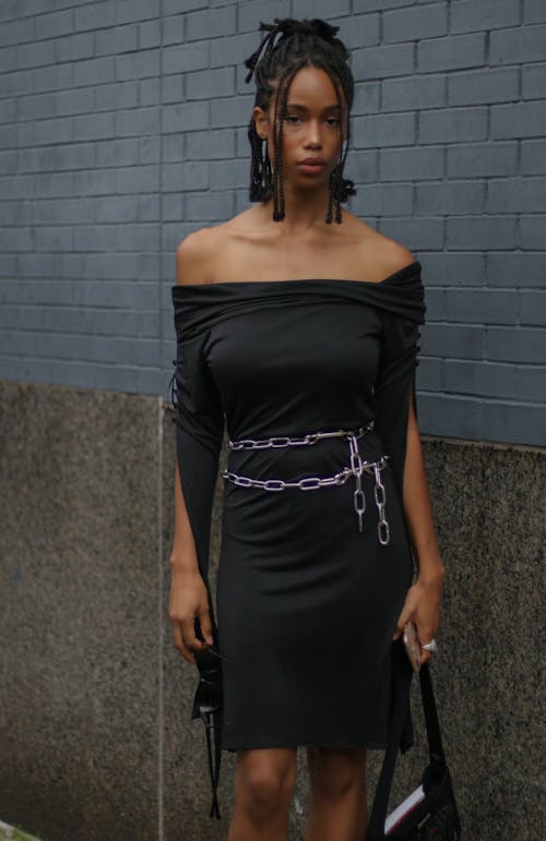 A Woman in Black Dress Standing