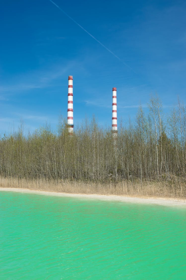 Factory Chimneys Under The Blue Sky