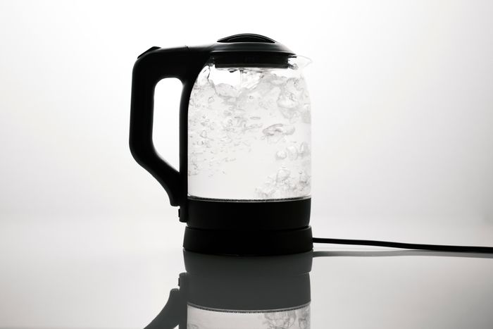 Glass electric kettle on a pale surface — photo by Engin Akyurt on Pexels