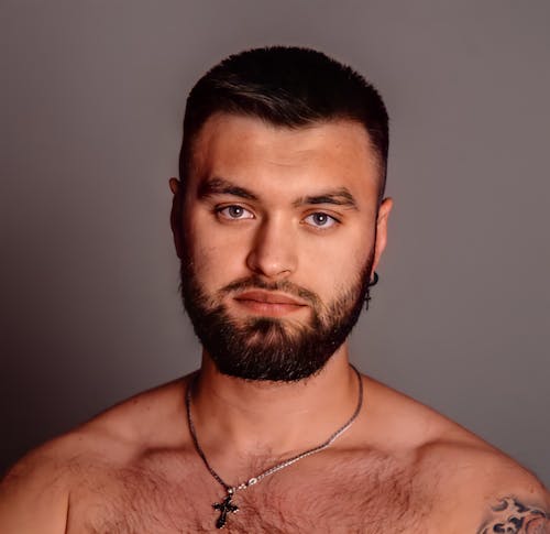 Topless Man Wearing Silver Necklace