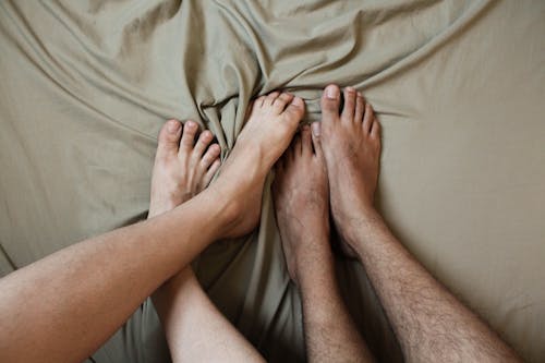 Free Close-Up Shot of Feet on the Blanket Stock Photo