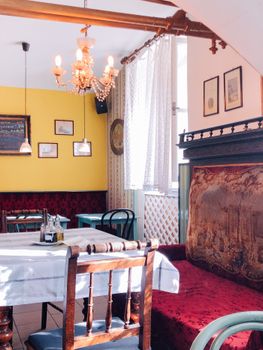 A charming vintage cafe interior featuring eclectic decor and a warm atmosphere.