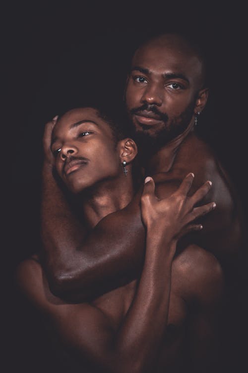 Topless Men Embracing