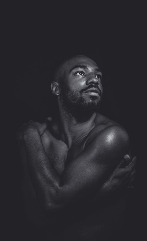 Free Black and white portrait of a shirtless man, captured in dramatic lighting. Stock Photo