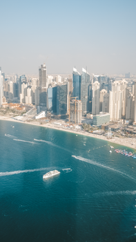 A breathtaking aerial view of the Dubai Marina skyline with skyscrapers along the waterfront.