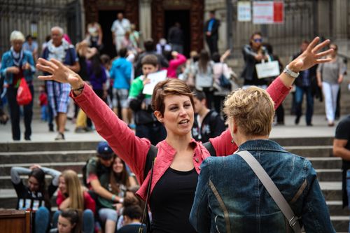 Free A bustling street scene in Barcelona with people interacting in a vibrant urban setting. Stock Photo