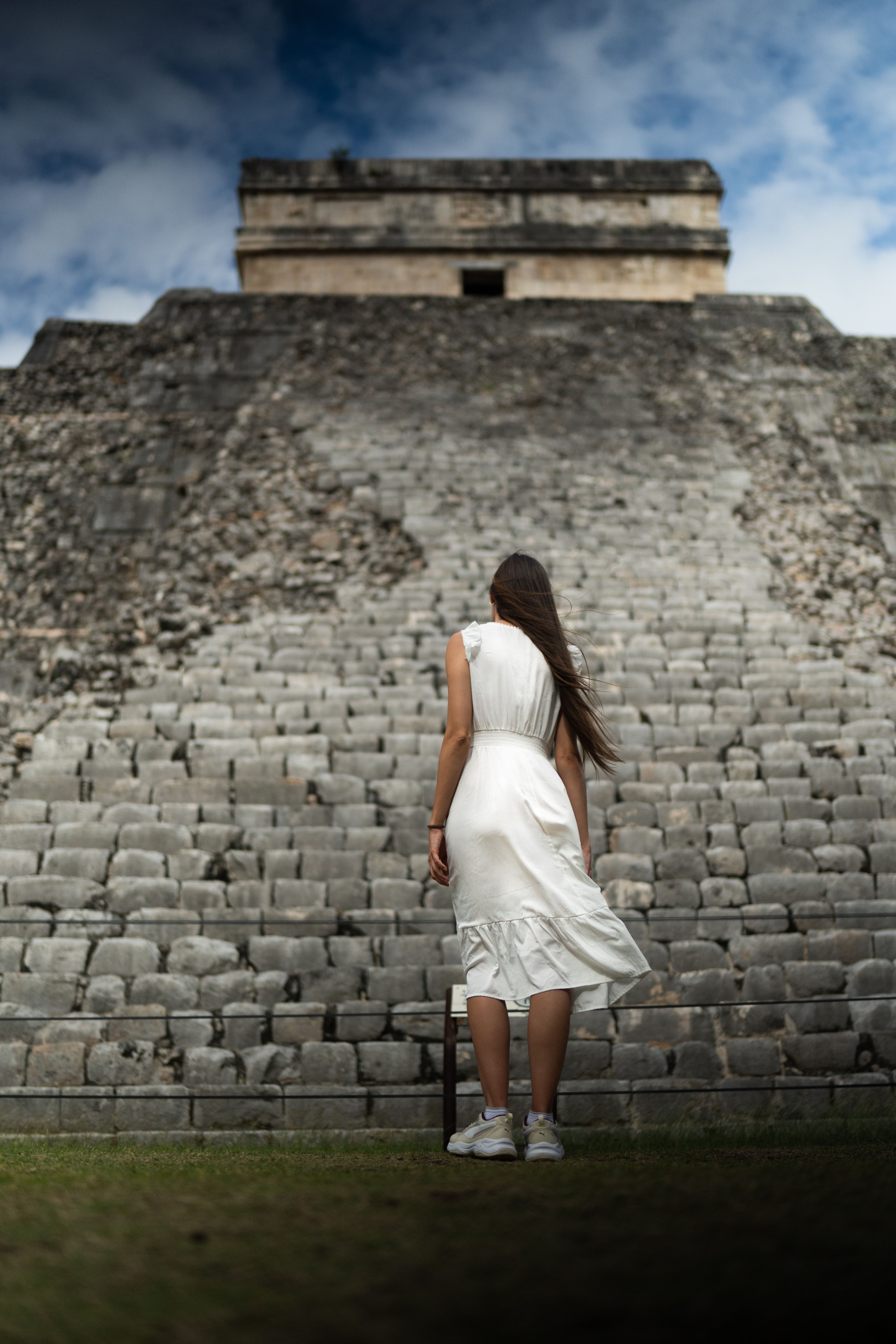 Woman in White Dress Standing in Front of a Pyramid · Free Stock Photo