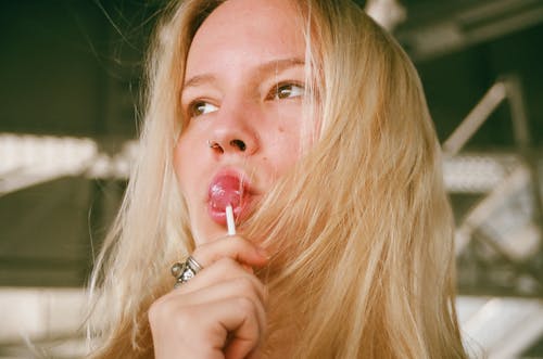 Free Woman Licking Lollipop Stock Photo