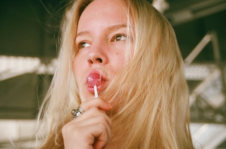 Woman Licking Lollipop