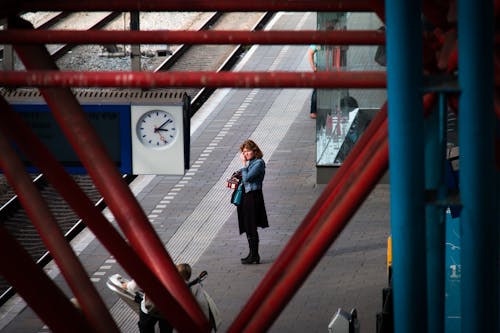 Woman Standing Near Rail Road