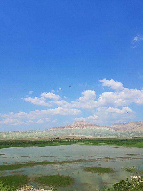 Free Vast mountain landscape with clear blue sky and vibrant nature view. Stock Photo