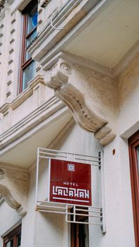 Vintage-style hotel facade featuring ornate architectural details and classic signage.