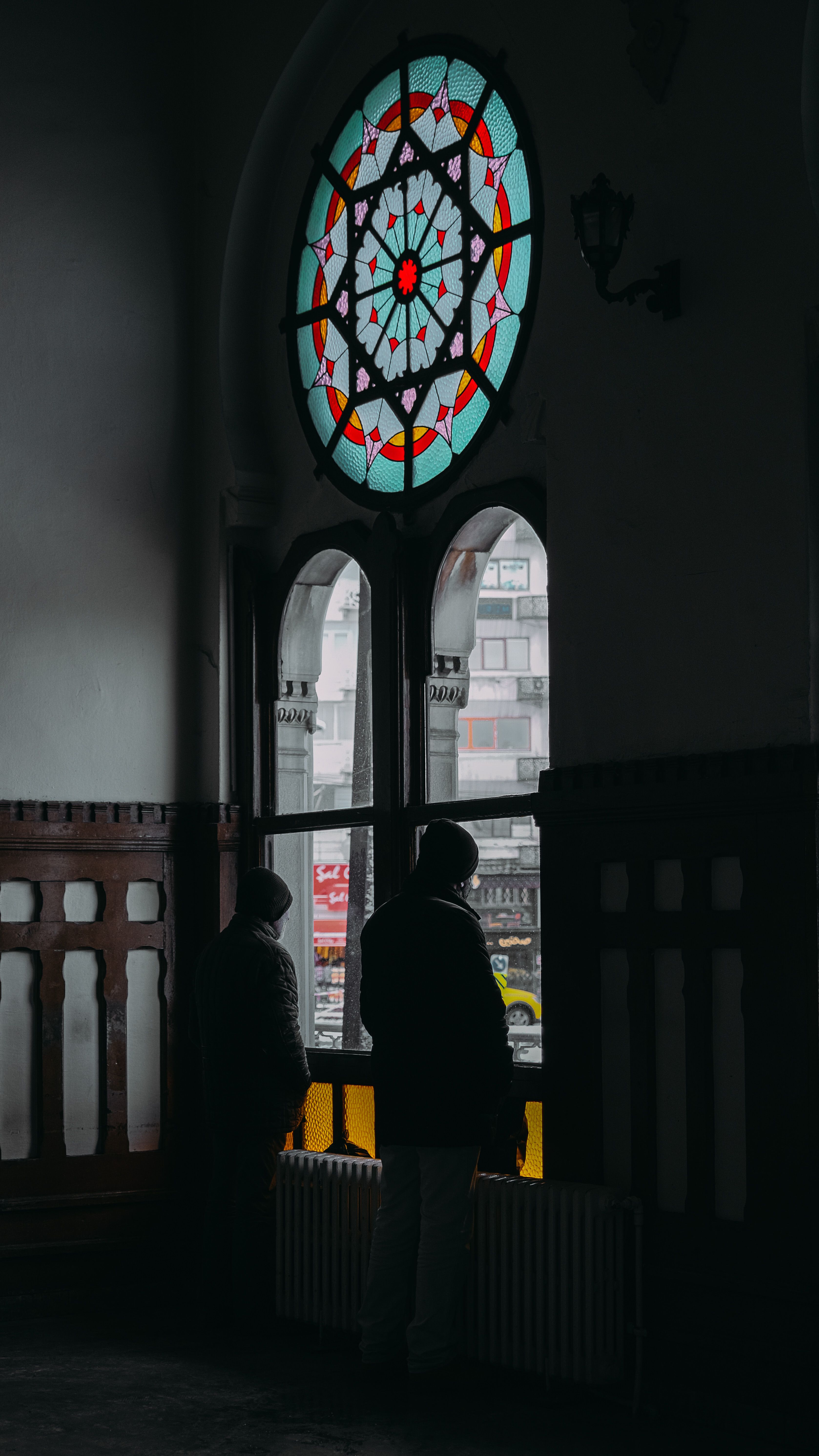 Silhouette of Person Standing in Front of Window · Free Stock Photo