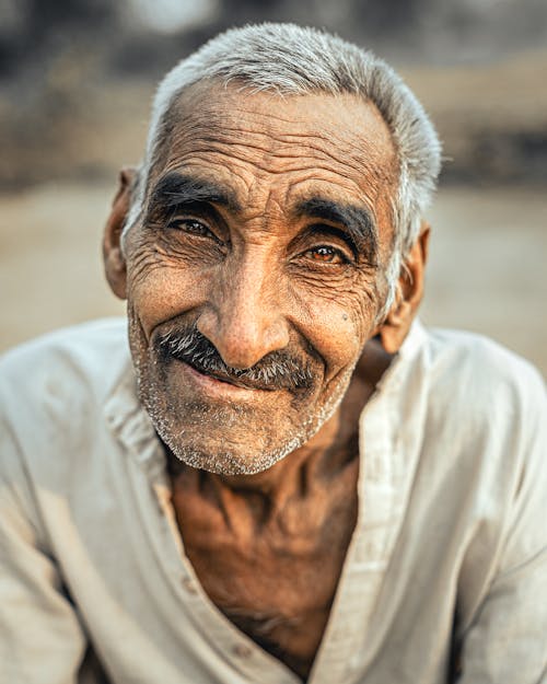 Smiling Elderly Man with Brown Eyes