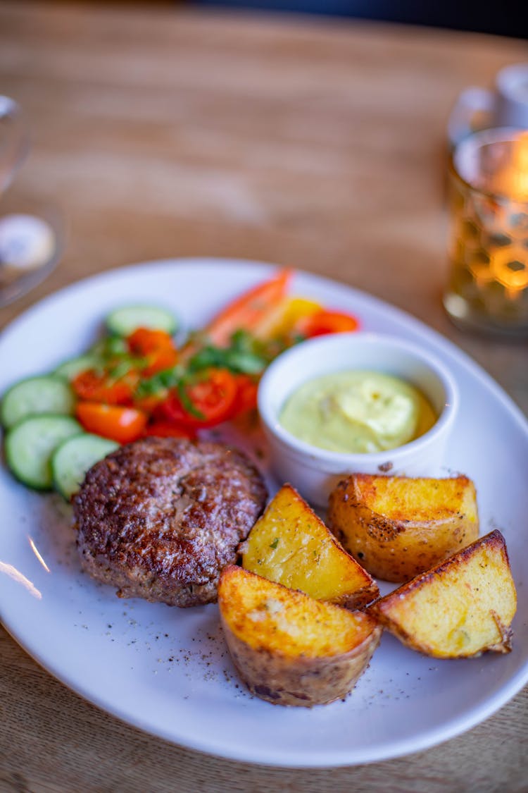 Dinner Of Potatoes And Chop On Plate