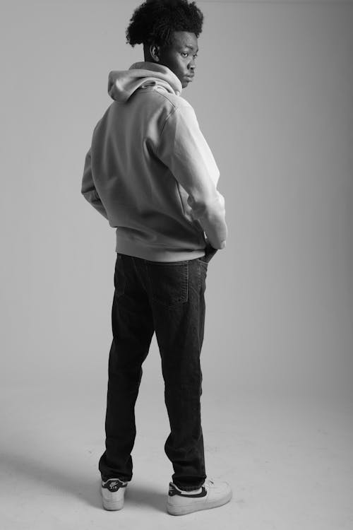 Grayscale Photo of a Man Wearing Hoodie