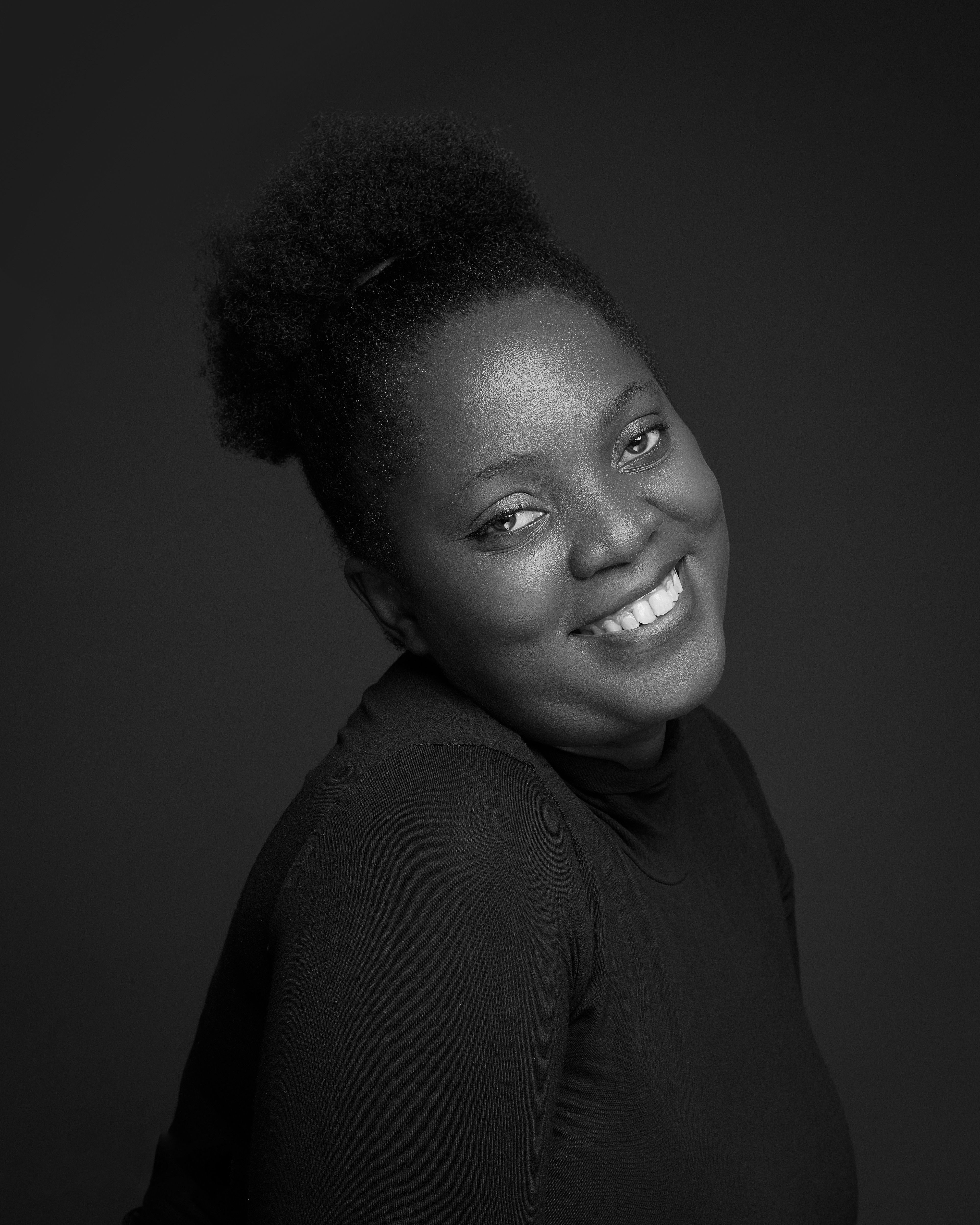 Black and White Portrait of a Smiling Woman · Free Stock Photo