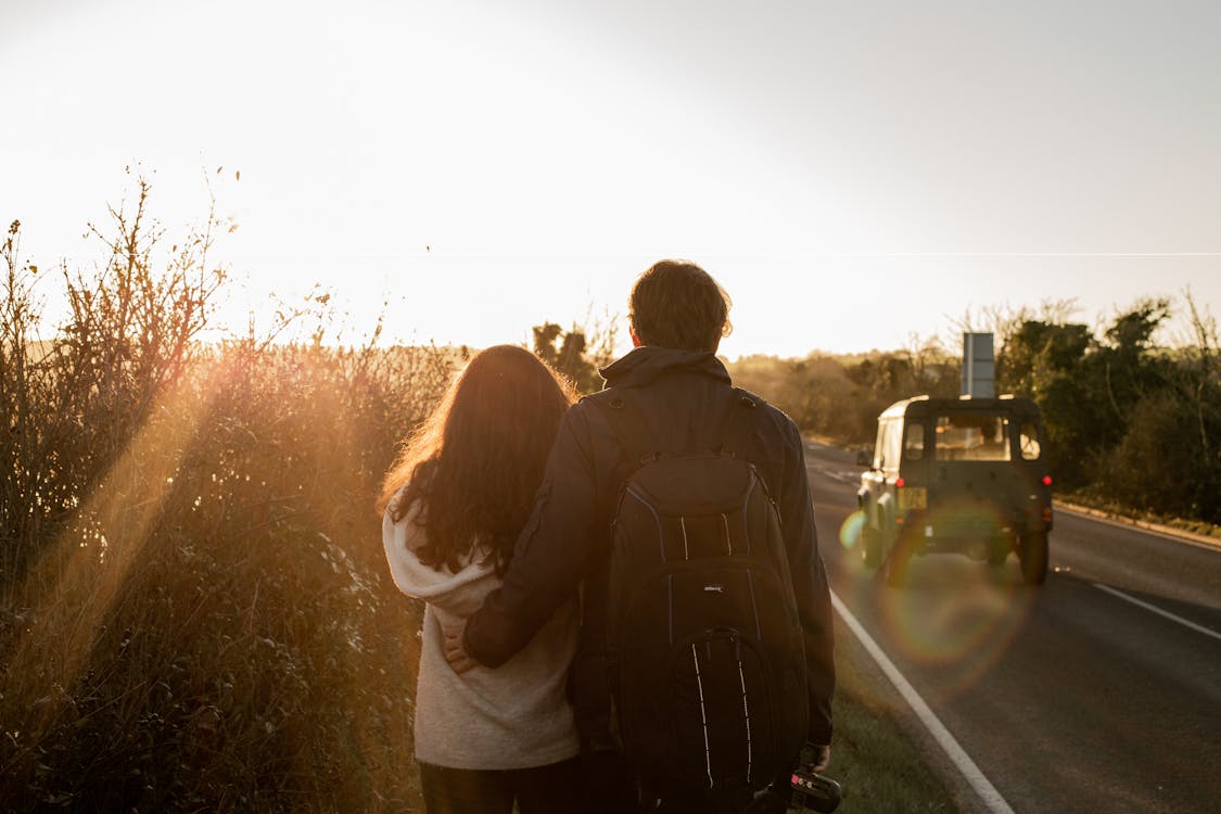 Free Couple Standing on Road Stock Photo