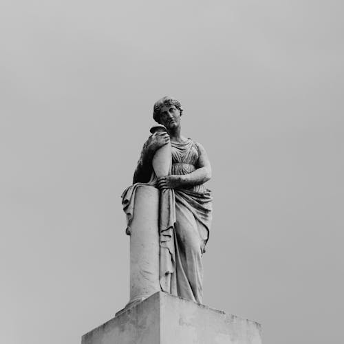 A Marble Statue in Black and White Photo