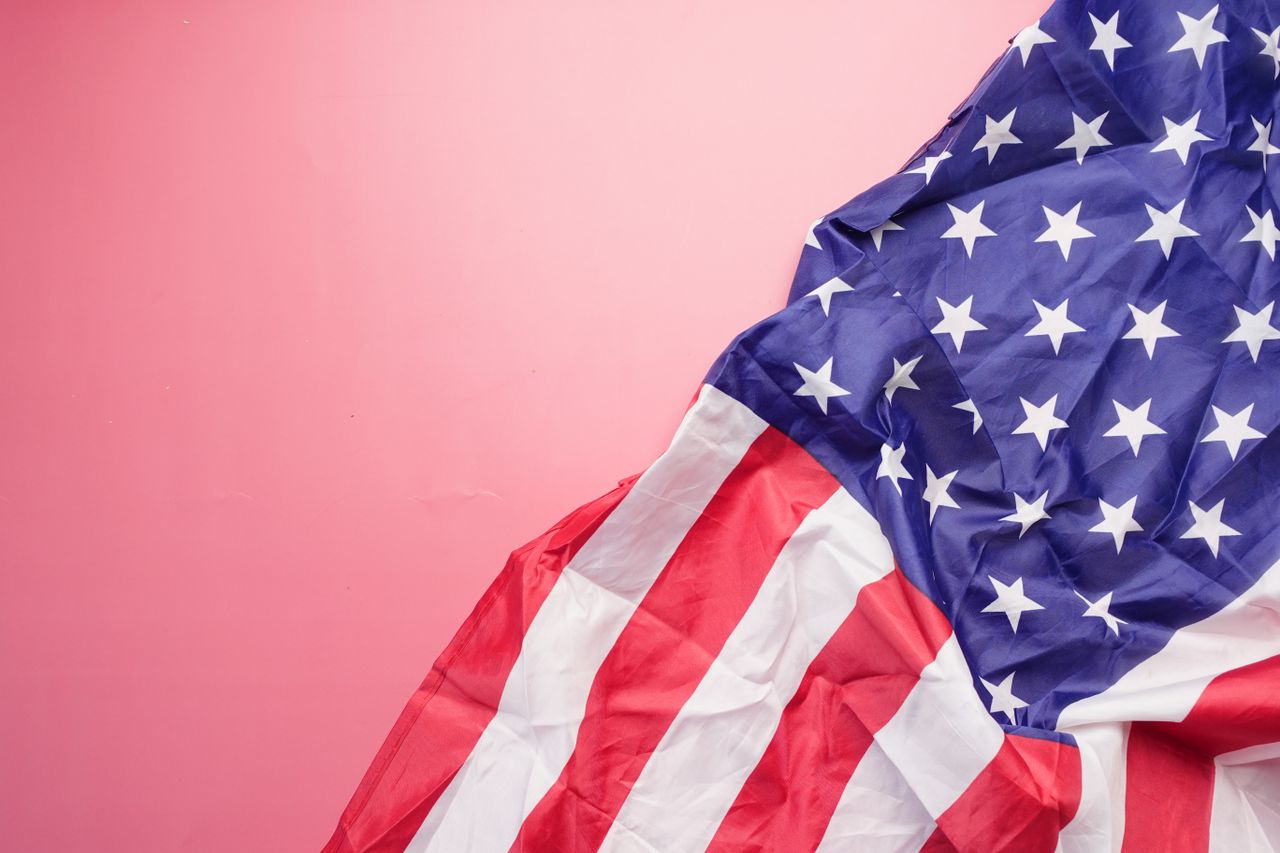 a vibrant image of the usa flag on a pink background symbolizing patri
