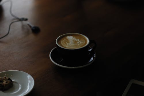 Coffee Art on a Black Ceramic Cup