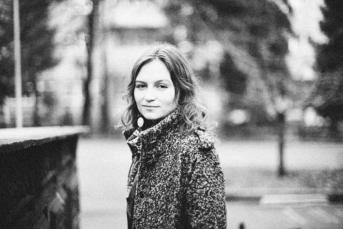 Free Grayscale Photo of a Woman Wearing Coat Stock Photo
