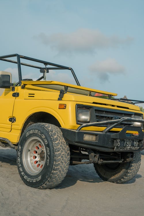 Yellow Jeep Wrangler Parked on Dirt Road Photo