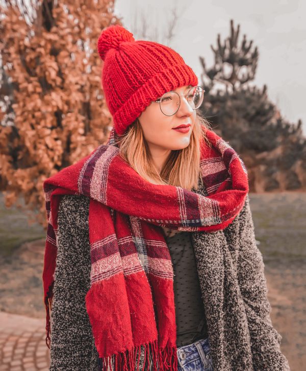Woman in jeans with plaid scarf
