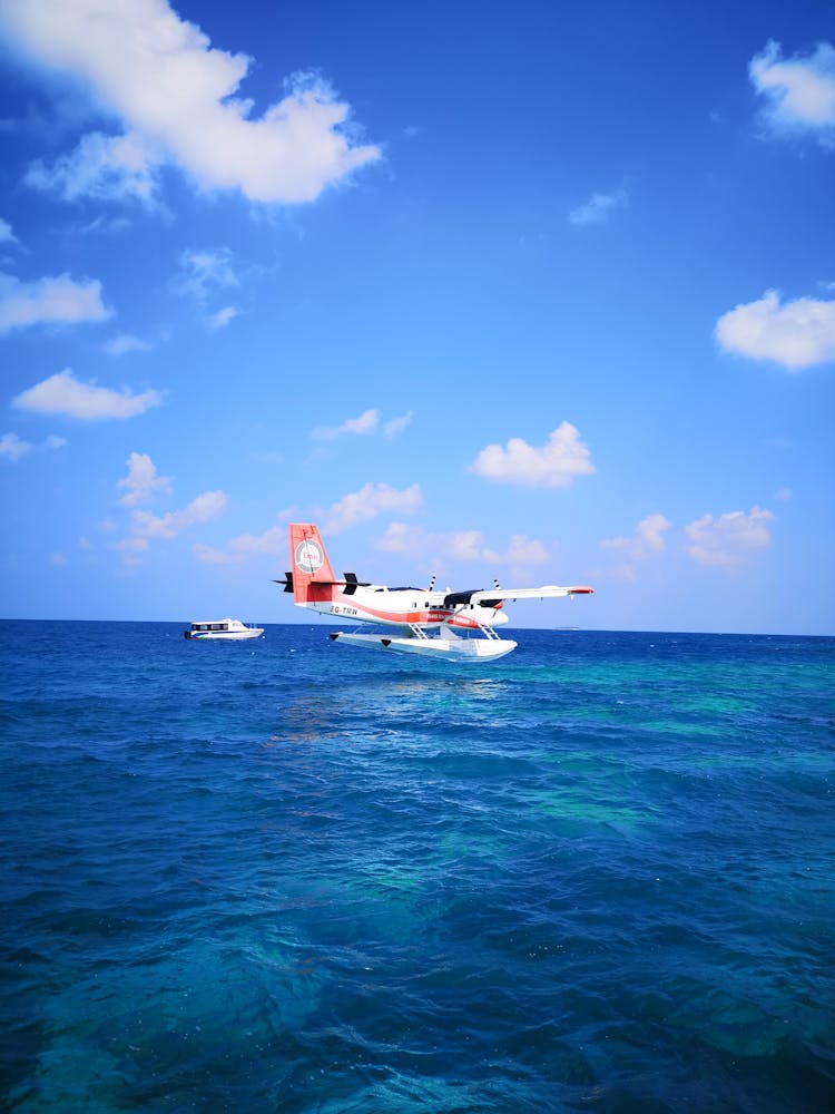 Airplane And Boat On Water