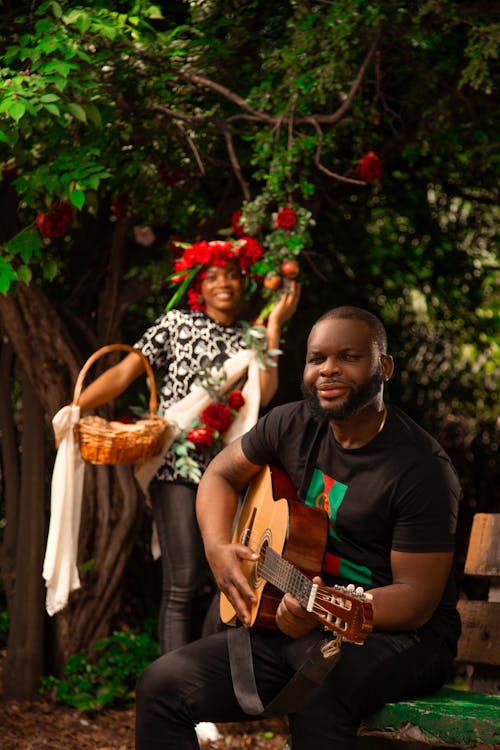 A Man Playing a Guitar