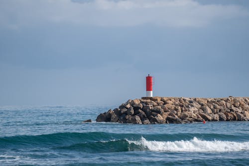 Free Ilmainen kuvapankkikuva tunnisteilla aallot, majakka, rantakivikko Stock Photo