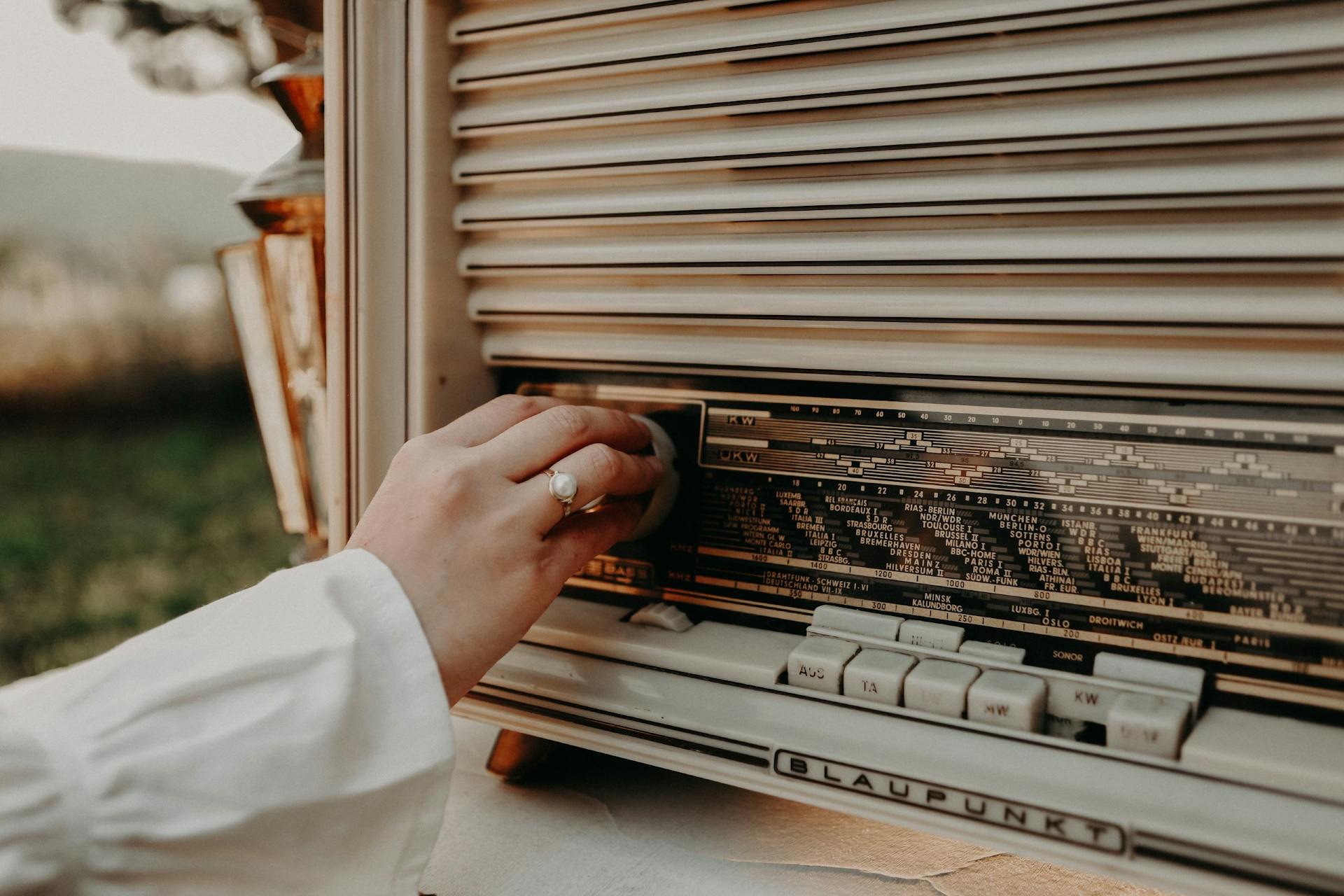 A Person Holding a Vintage Music Player